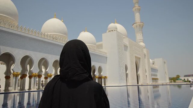 Woman in Black Abaya Facing Sheikh Zayed Grand Mosque