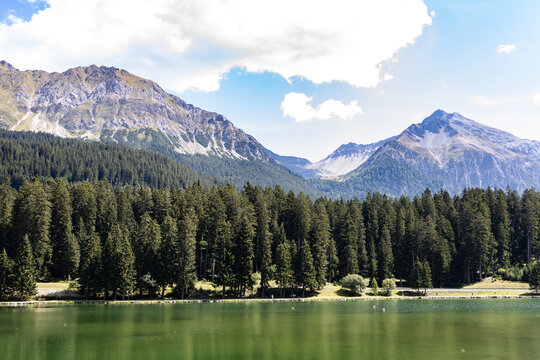 North Italian Mountains With Clouds, Forest and Blue Sky