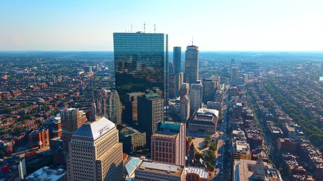 Rising high over the hazy scenery of a modern lively Boston, Massachusetts, USA. Revealing view on the gorgeous glossy 200 Clarendon skyscraper in Back Bay area.