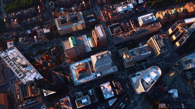 Slow descend over the rooftops of a modern lively metropolis. Buildings and streets of Boston, Massachusetts, USA from top.