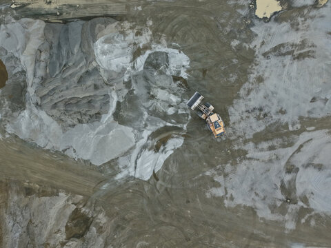 Montrose, Australia - 26 August 2026: Aerial view of Boral Montrose quarry with heavy machinery moving gravel and sand across the industrial site.
