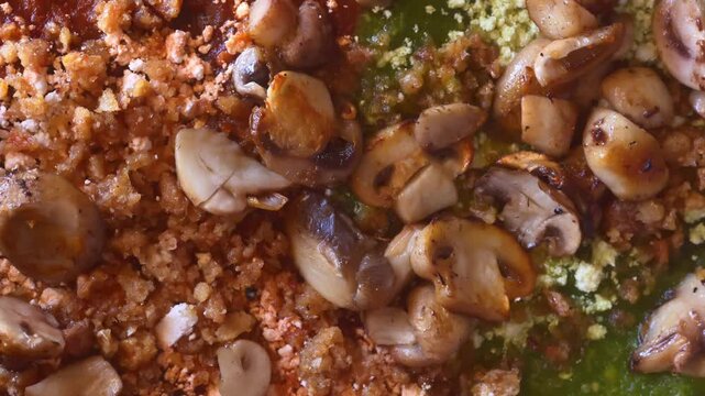 Close-Up cetail of Mexican Sopes topped with saut&eacute;ed mushrooms, chicharron, queso fresco and red and green salsa