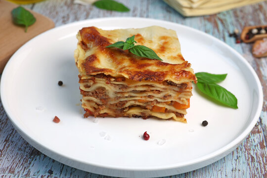 lasagna with basil leaf on plate