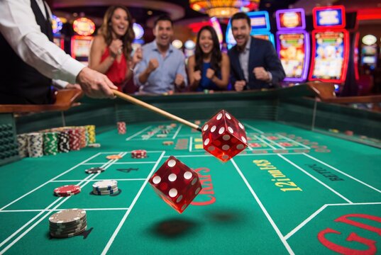 Craps table game in casino with rolling dice and happy winners