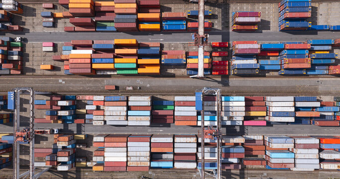 Matosinhos, Portugal - 22 August 2026: Aerial view of Porto de Leixoes showing rows of colorful shipping containers stacked in the port terminal.