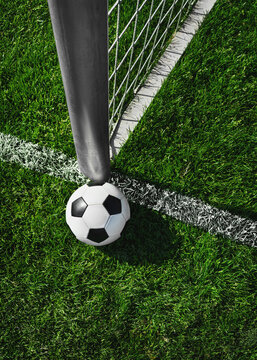 Textured soccer game field with soccer ball - center, midfield view from above.