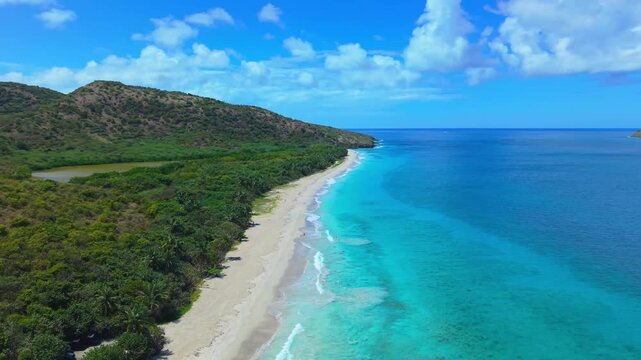 Tropical Aerial Drone Shot of Calm Waves and Shore at Zoni Beach Culebra