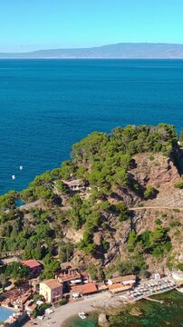 Mazzar&ograve; Bay In Taormina Mare On The East Coast Of Sicily, Italy. Vertical, Aerial Pullback Shot