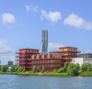 Modern waterfront apartments with twisting skyscraper beyond Gothenburg.