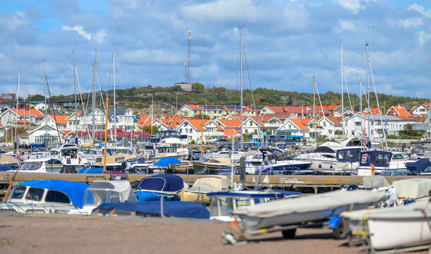 Marstrand, Sweden - August 20 2026: Small motorboat cruising through sheltered Swedish coastal harbor.