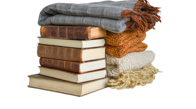Stack of vintage books with folded warm woolen blankets isolated on transparent background as png file