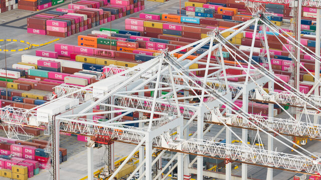 Southampton, England, United Kingdom - 01 August 2026: Aerial view of DP World Southampton container terminal with rows of colorful shipping containers and large loading cranes.