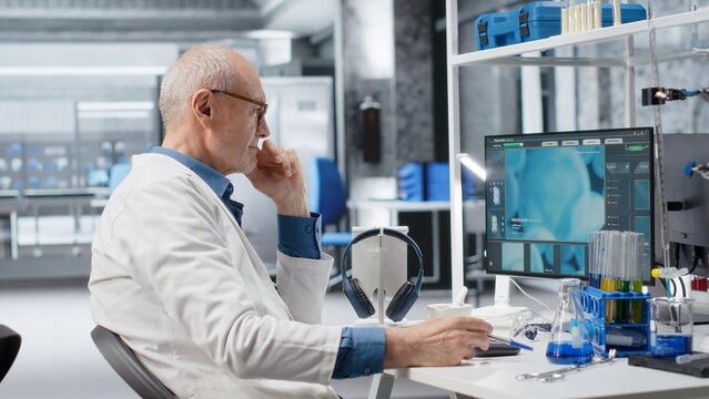 Aged male scientist waits impatiently for experiment data in the laboratory, showing agitation and curiosity during advanced genetics research while remaining engaged in the study.