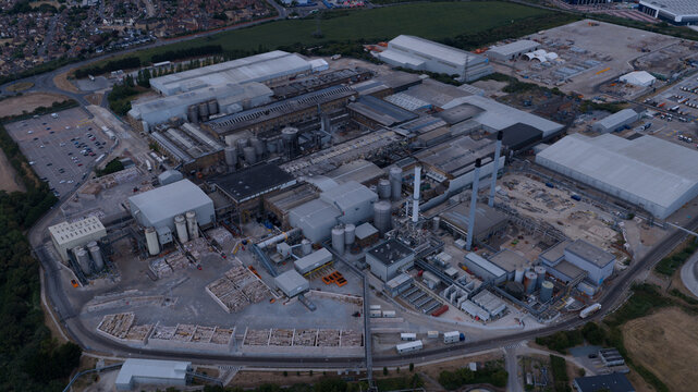 Sittingbourne, United Kingdom - 30 July 2026: Aerial view of DS Smith Kemsley Paper Mill, showing large industrial buildings, storage yards, tall chimneys, and surrounding infrastructure.