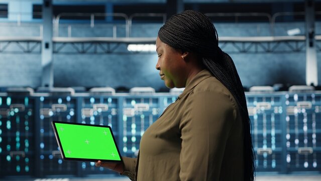 Data center admin uses green screen tablet for server deployment