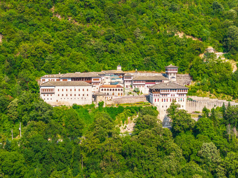 Aerial view of Bigorski Monastery St John the Baptist nestled in lush mountains with stone architecture and terracotta roofs in Rostushe, Municipality of Mavro, North Macedonia.