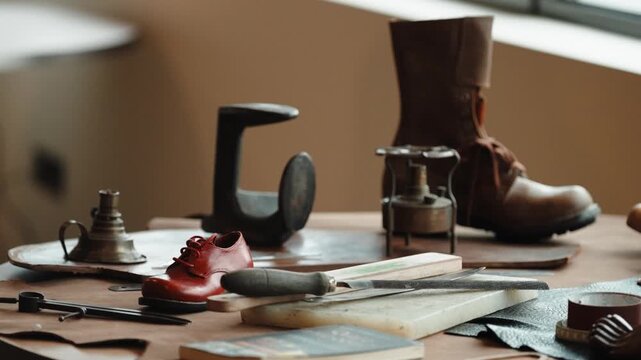 Cobbler Workbench with Brown Leather Boot Red Shoe Cast Iron Last Brass Lamp and Tools