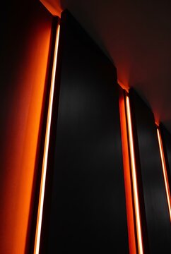 Vertical 3D wafers lit by glowing orange beams