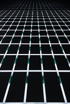 Towering 3D modules lit by green accents