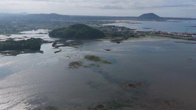 Aerial View Of Ojo Port And Siksanbong (Bawi Oreum) In Ojo-ri, Seongsan-eup, Seogwipo-si, Jeju Island, South Korea.