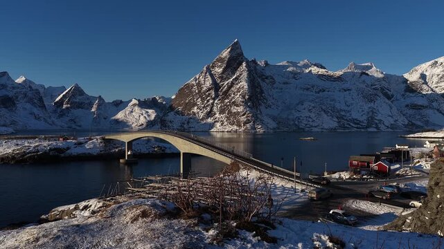 Aerial view flying over hamnoy fishing village bridge in lofoten, Norway