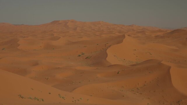 Rolling orange sand dunes of Erg Chebbi near Merzouga in the Moroccan Sahara