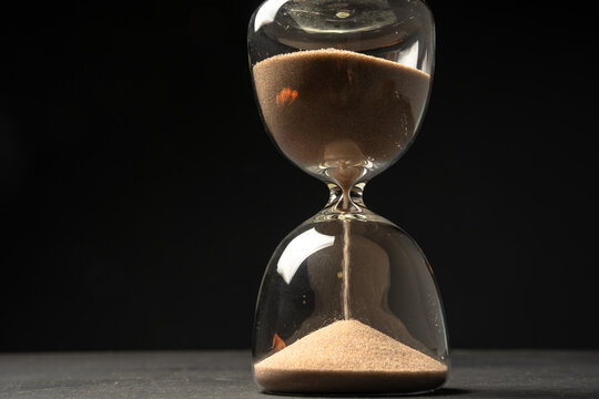 The hourglass is on the table