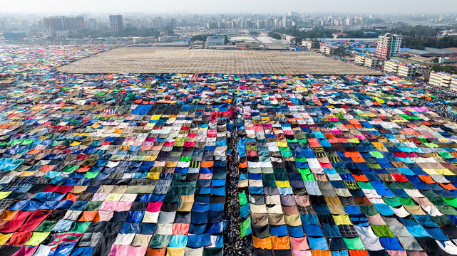 Aerial view of the Bishwa Ijtema gathering, featuring a vast expanse of colorful tents and shelters arranged in a grid pattern with crowds of people in Tongi, Dhaka Division, Bangladesh.