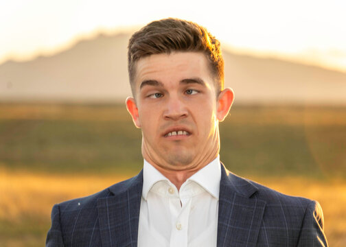 Man in Suit Makes Funny Face Outdoors