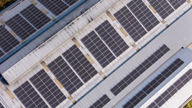 Aerial view of solar panels installed on a metal roof in Klaten, Central Java, Indonesia.