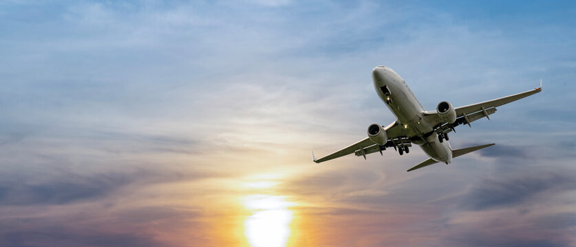Airplane in the sky at sunset time with clear sky