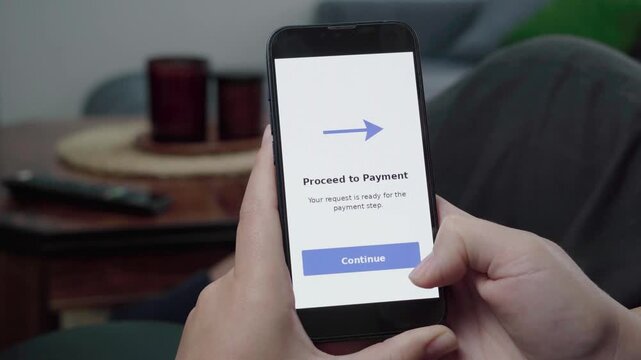 Customer reviews an app message reading Proceed to Payment with a large Continue button during an online checkout flow.