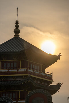 Pagoda Pantjoran Chinatown PIK is silhouetted against the sunlight