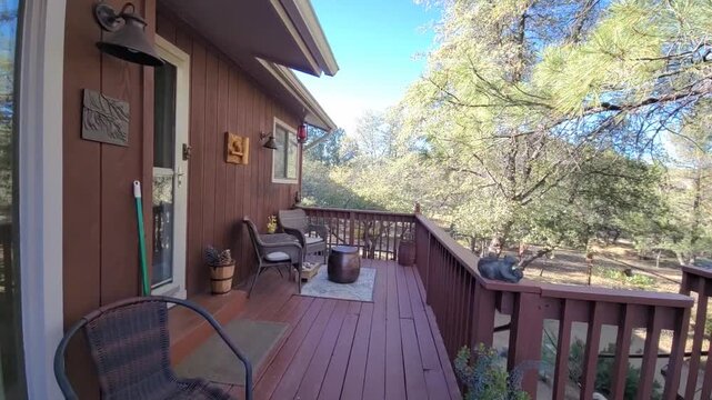 Wooden cabin deck with outdoor seating