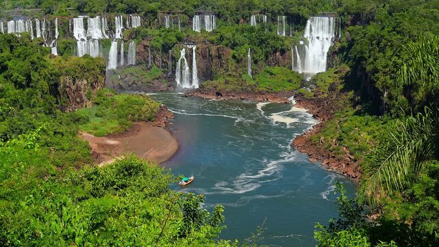 Aerial view of waterfalls with a tourist boat in the river, Argentina and Brazil border