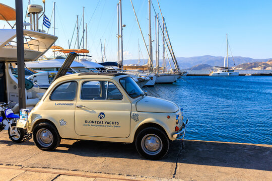 Coastal harbor view with small car near water