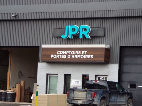 Gatineau, Quebec, Canada &ndash; June 28, 2026: A commercial building exterior features signage for "JPR" and "Comptoirs et Portes d'Armoires", with a parked pickup truck at 625 Bd Saint-Ren&eacute; E.