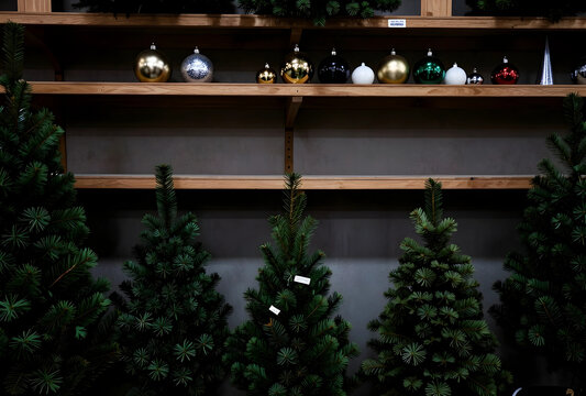 Christmas holiday shopping and festive season preparation, artificial trees and ornaments on display in a store