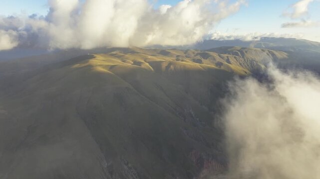 Golden Andes foothills beneath clouds in Jujuy, Argentina