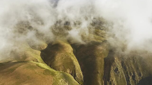 Golden Andes foothills beneath clouds in Jujuy, Argentina
