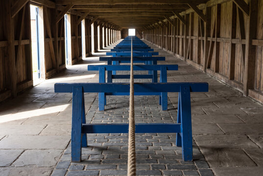 Timber Passage with Blue Barrier in a Historic Covered Bridge