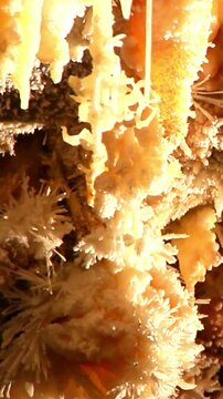 Stunning stalactites and stalagmites inside a deep natural limestone cave