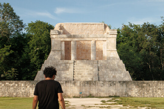 young person walking in the archaeological zone of Chichen Itza, Yucatan, Mexico