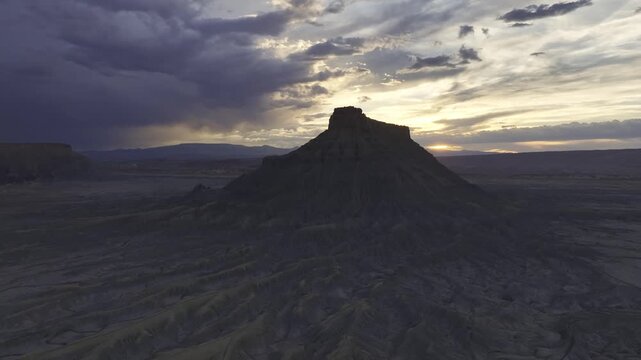 Aerial view of Factory Butte sandstone formations at sunset