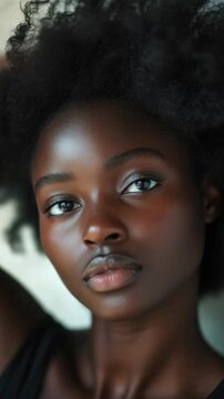 Close-up Portrait of a Beautiful Black Woman with Voluminous Curly Hair