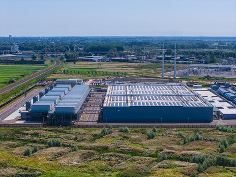 Aerial view of the Google data center in Westpoort, featuring industrial buildings with rooftop solar panels and cooling infrastructure in Amsterdam, North Holland, Netherlands.