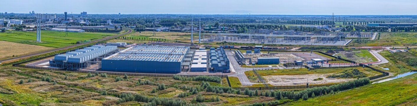 Aerial view of the Westpoort Google data center with industrial buildings, cooling units, and electrical infrastructure in Amsterdam, North Holland, Netherlands.