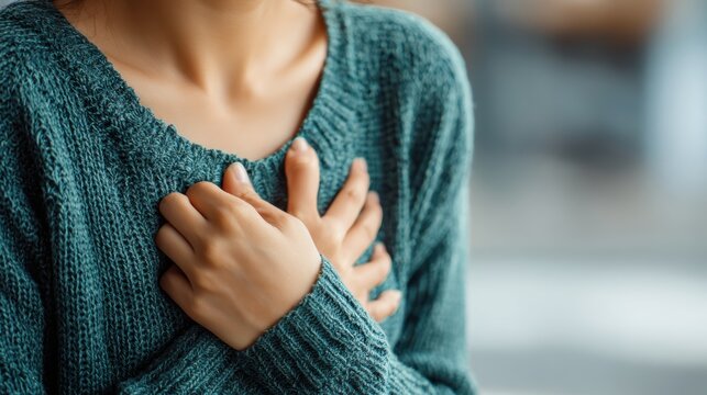 hand hold chest with heart attack symptoms, have chest pain caused by heart disease, leak, dilatation, enlarged coronary heart, press on the chest with a painful expression