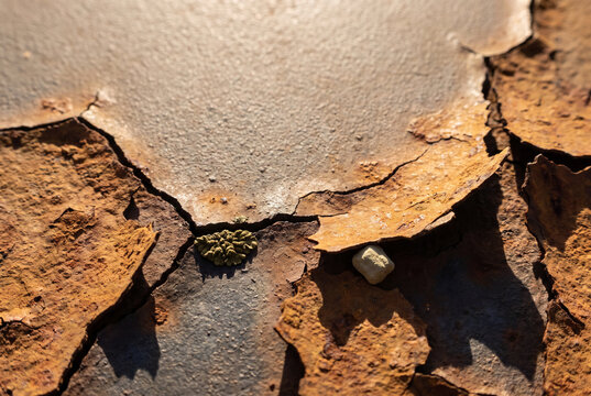 Corrosion texture with flaking rust and cracked metal surface background