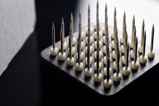 Acupuncture Needles Arranged on Foam Pad for Wellness Treatment